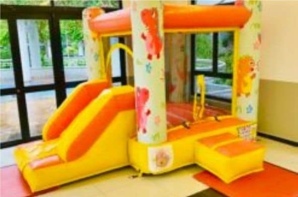 Dino Slide themed bouncy castle by BounceParkSG