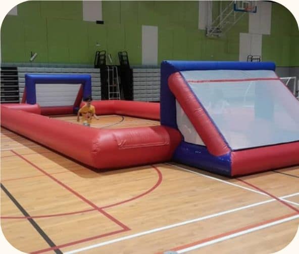 Human Foosball inflatable pitch by BounceParkSG