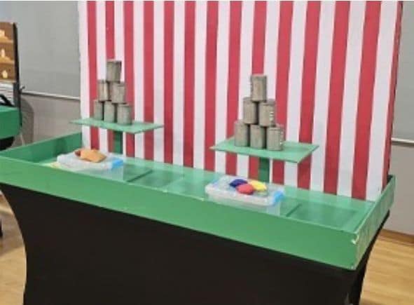 Knock Cans Down carnival game by BounceParkSG