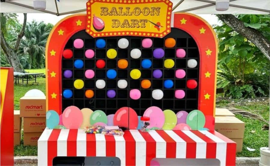 Large balloon dart wall by BounceParkSG