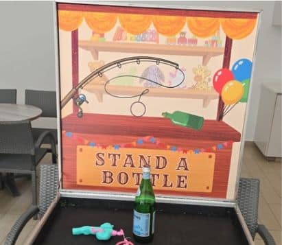 Stand a Bottle carnival game by BounceParkSG