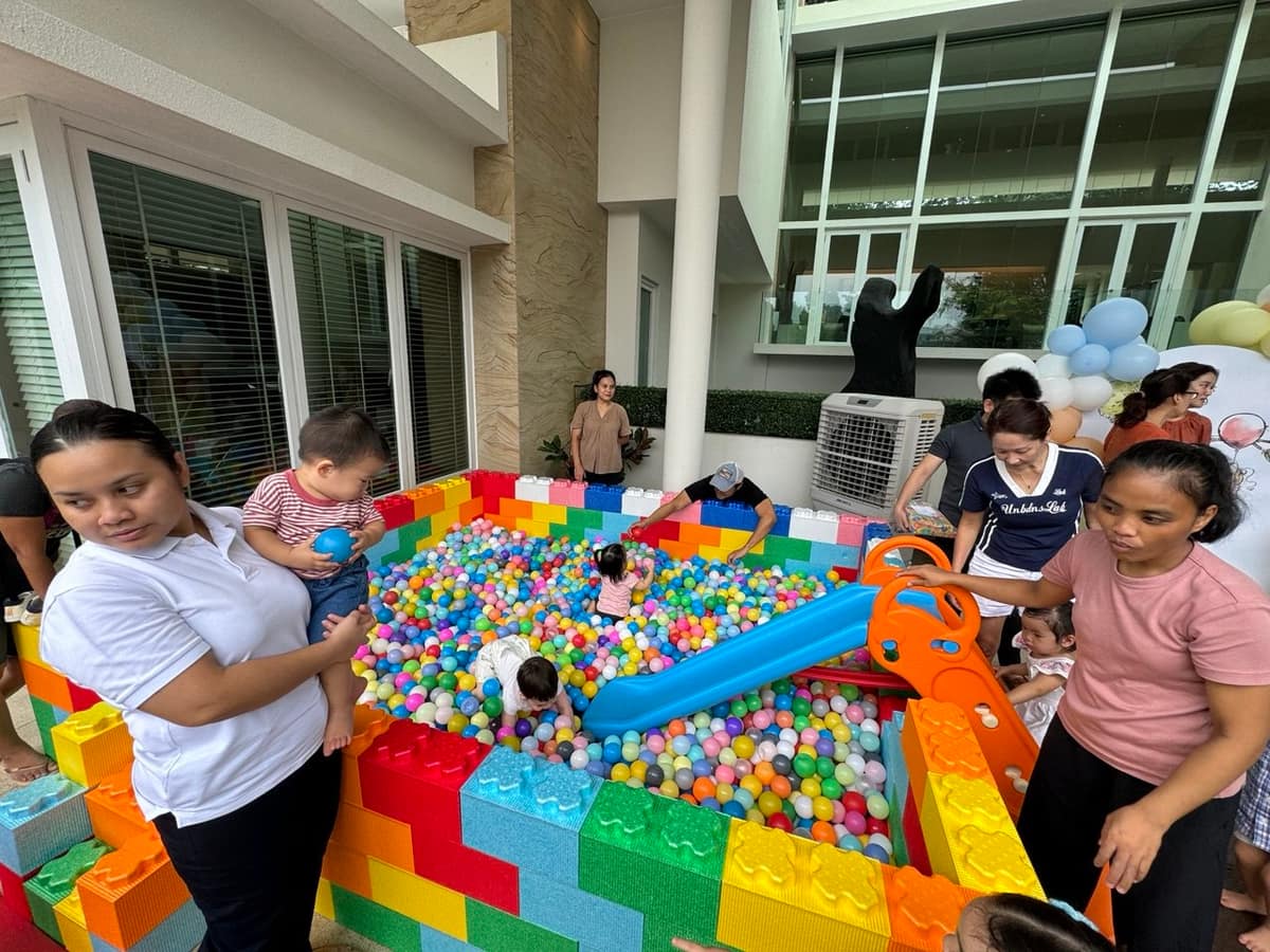 Mother and child at a ball pit with blocks