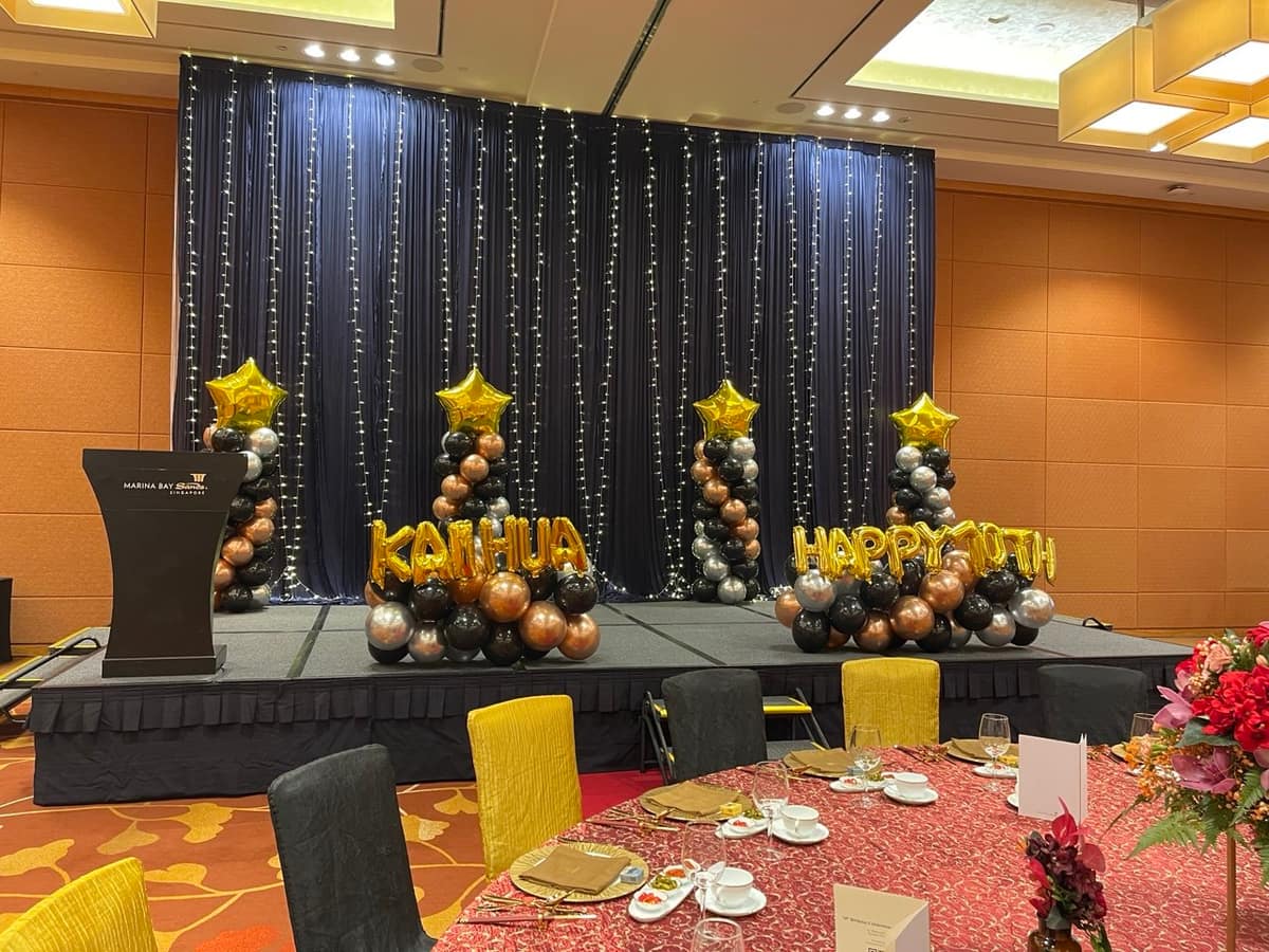 Gold star balloon stage backdrop