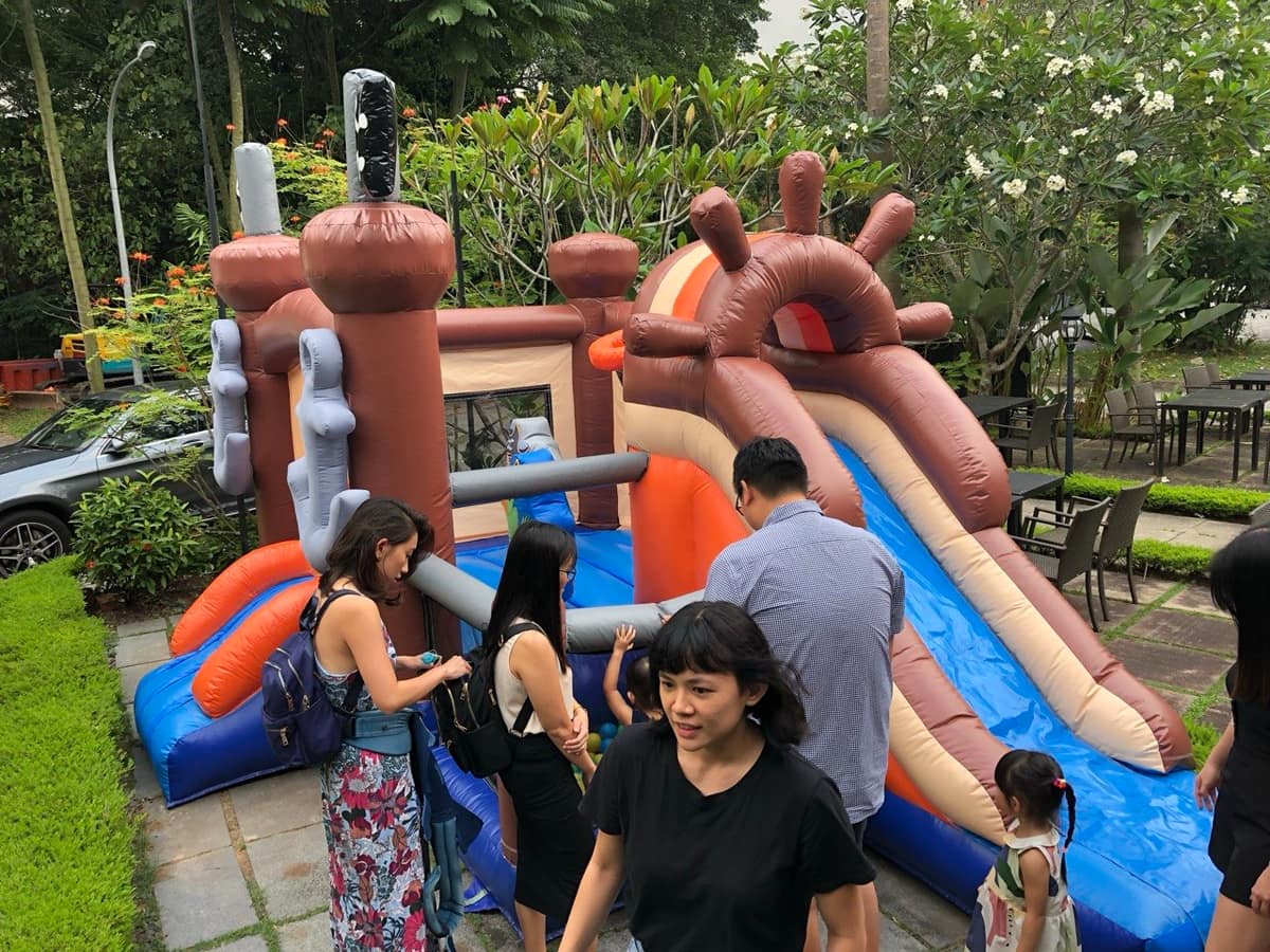 Bouncy castle with slide at a garden pavilion