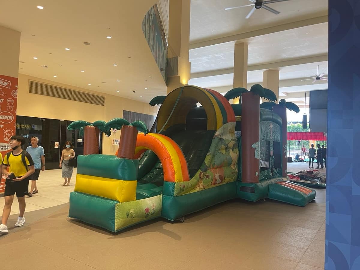 Jungle themed bouncy castle in an indoor atrium