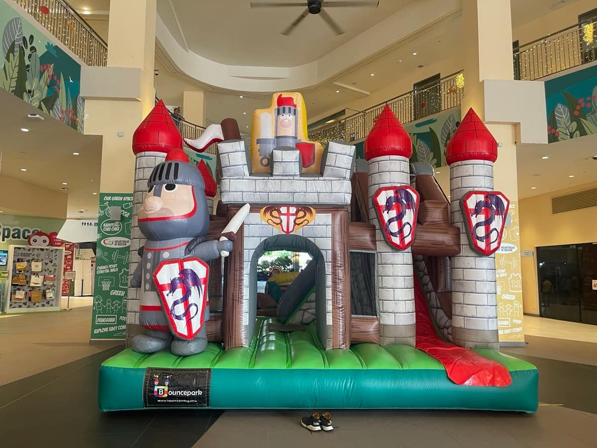 Knight's Castle bouncy castle in a mall atrium