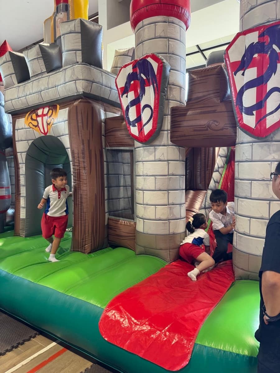 Boy running through an inflatable castle tower