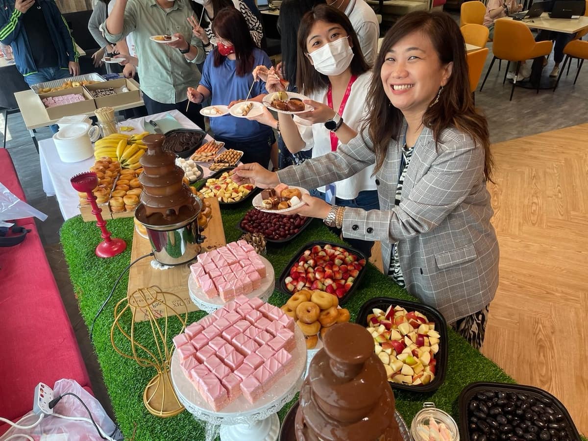 Guest smiling at a dessert buffet spread