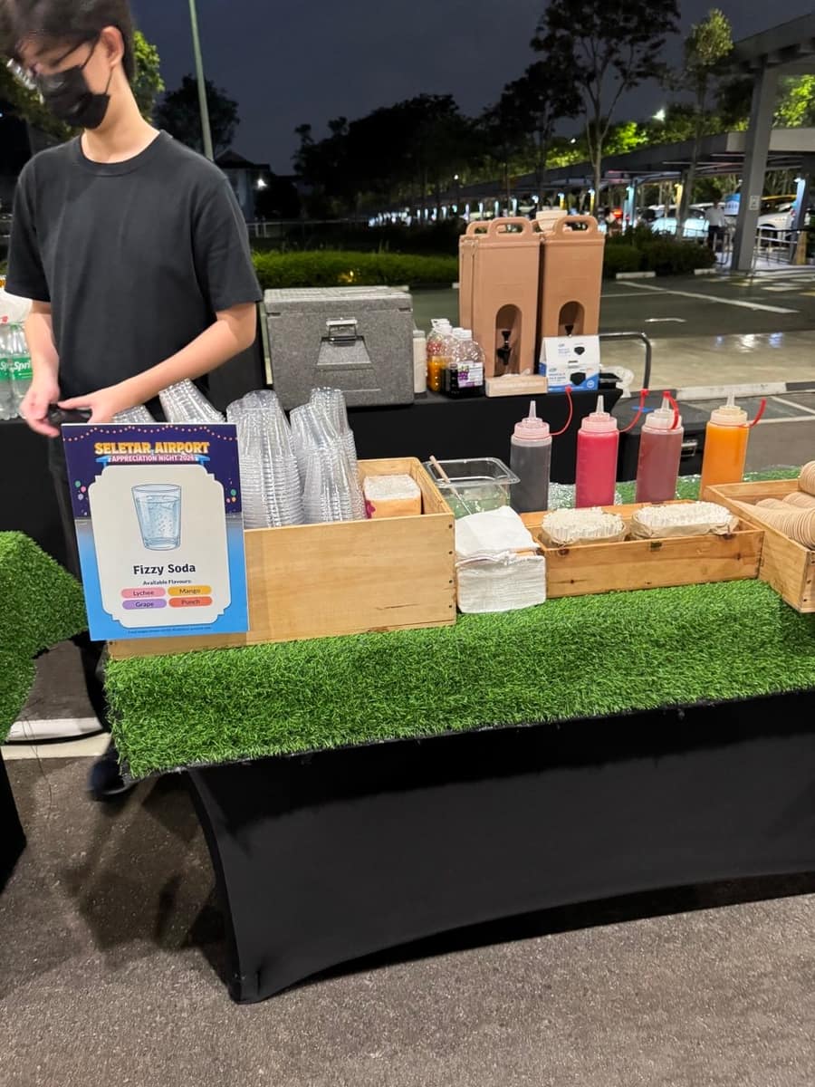Staffed fizzy soda drink station