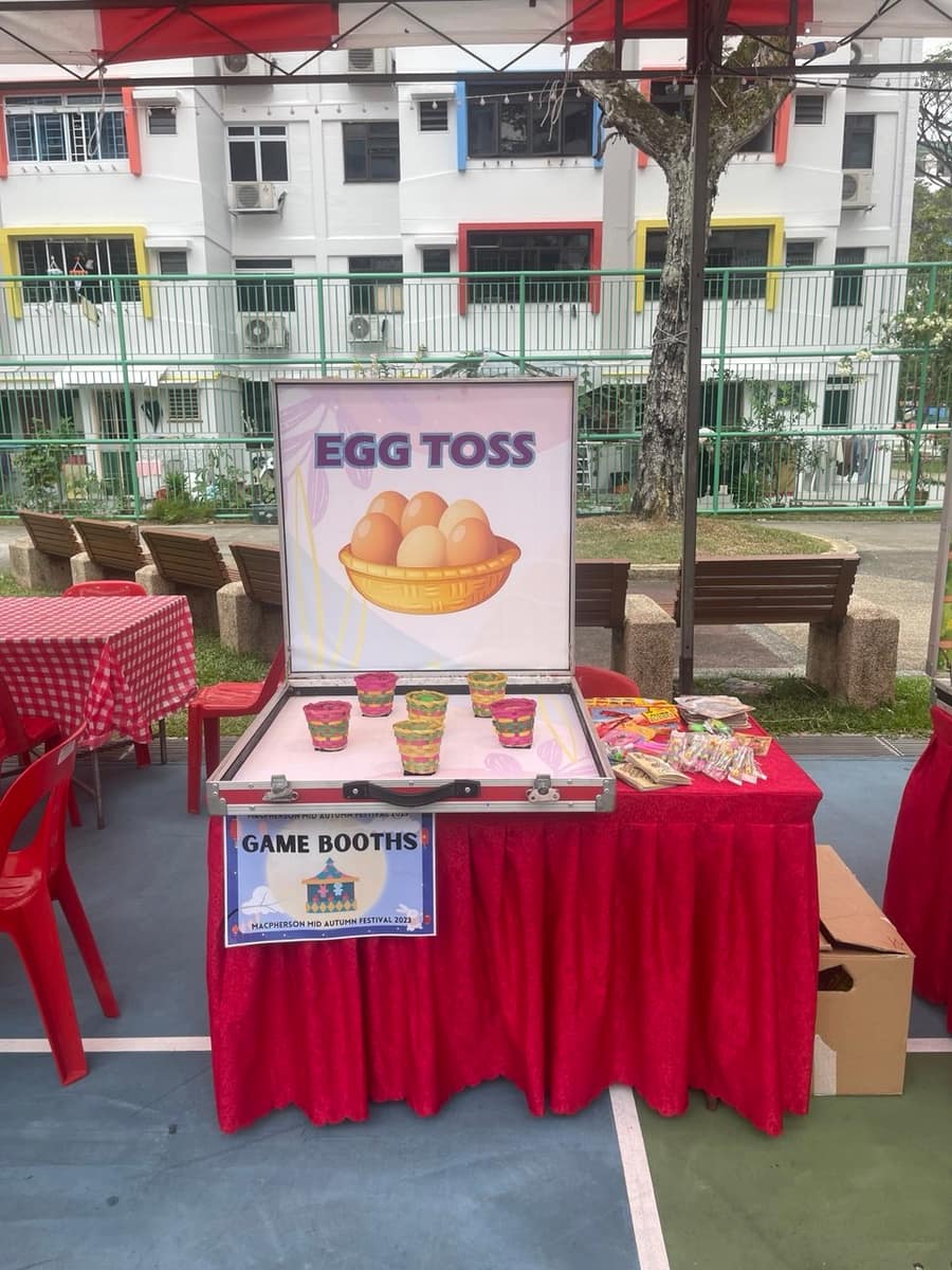 Egg toss booth at an HDB carnival