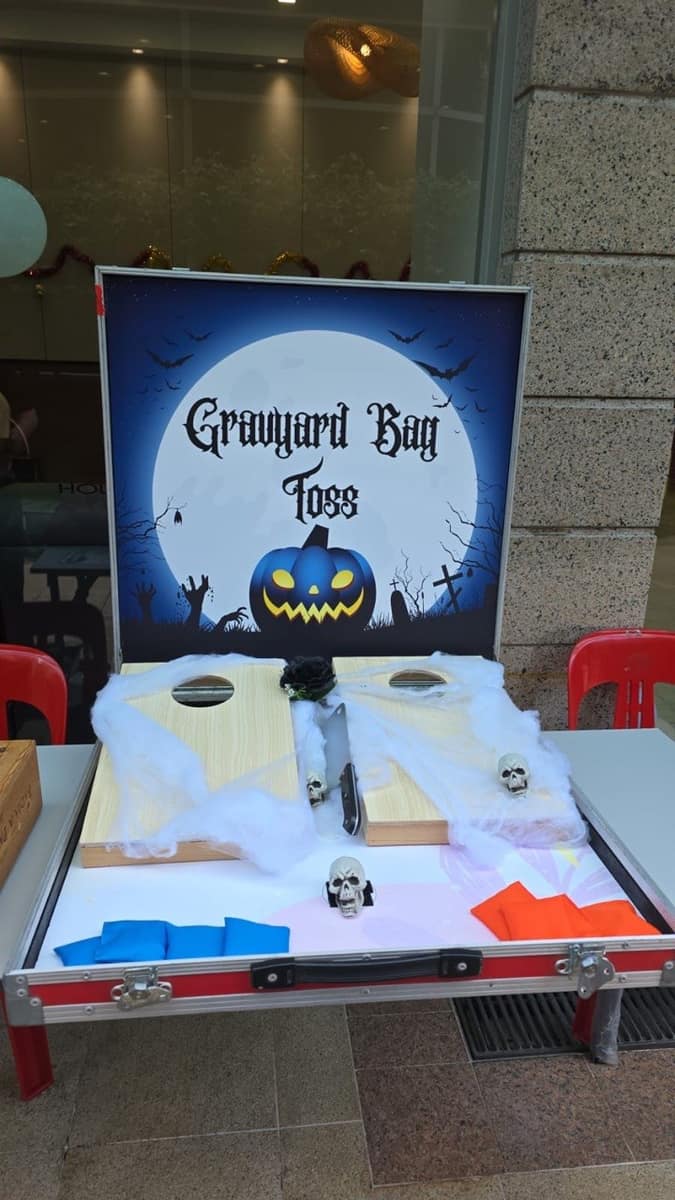 Halloween graveyard bag toss game