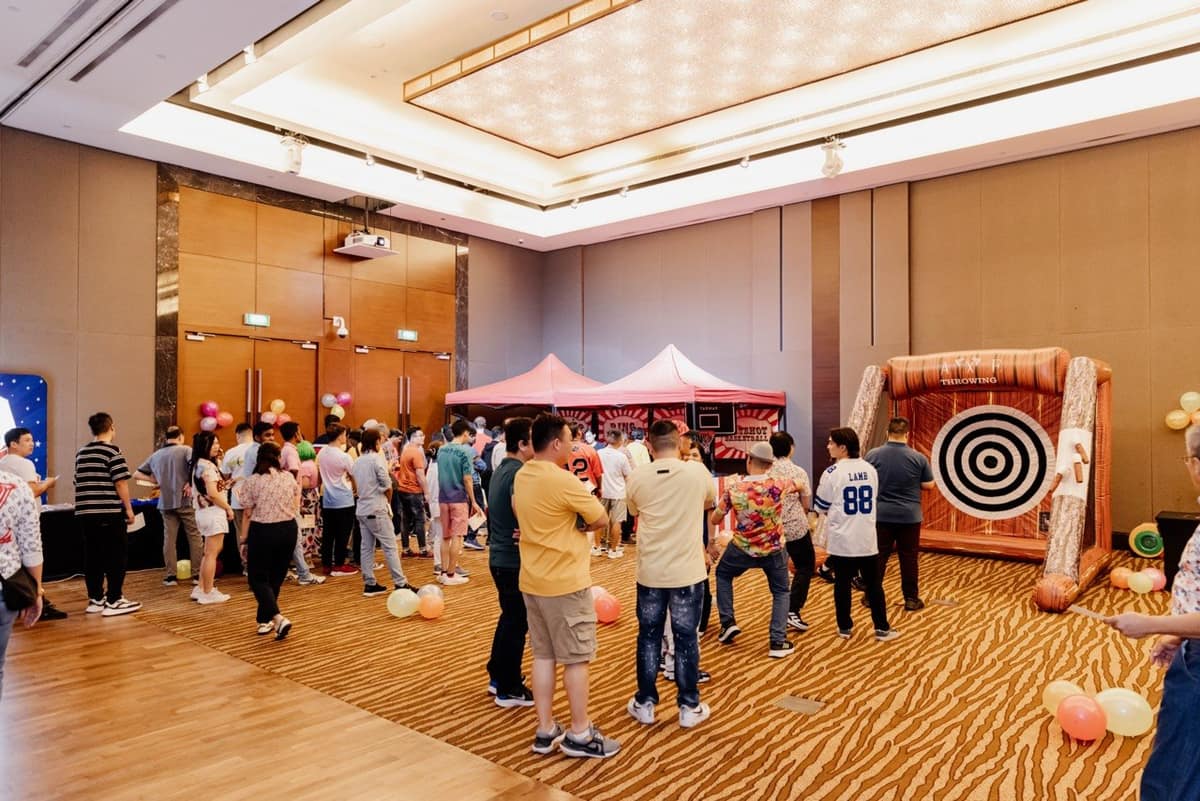 Crowd at a carnival target game