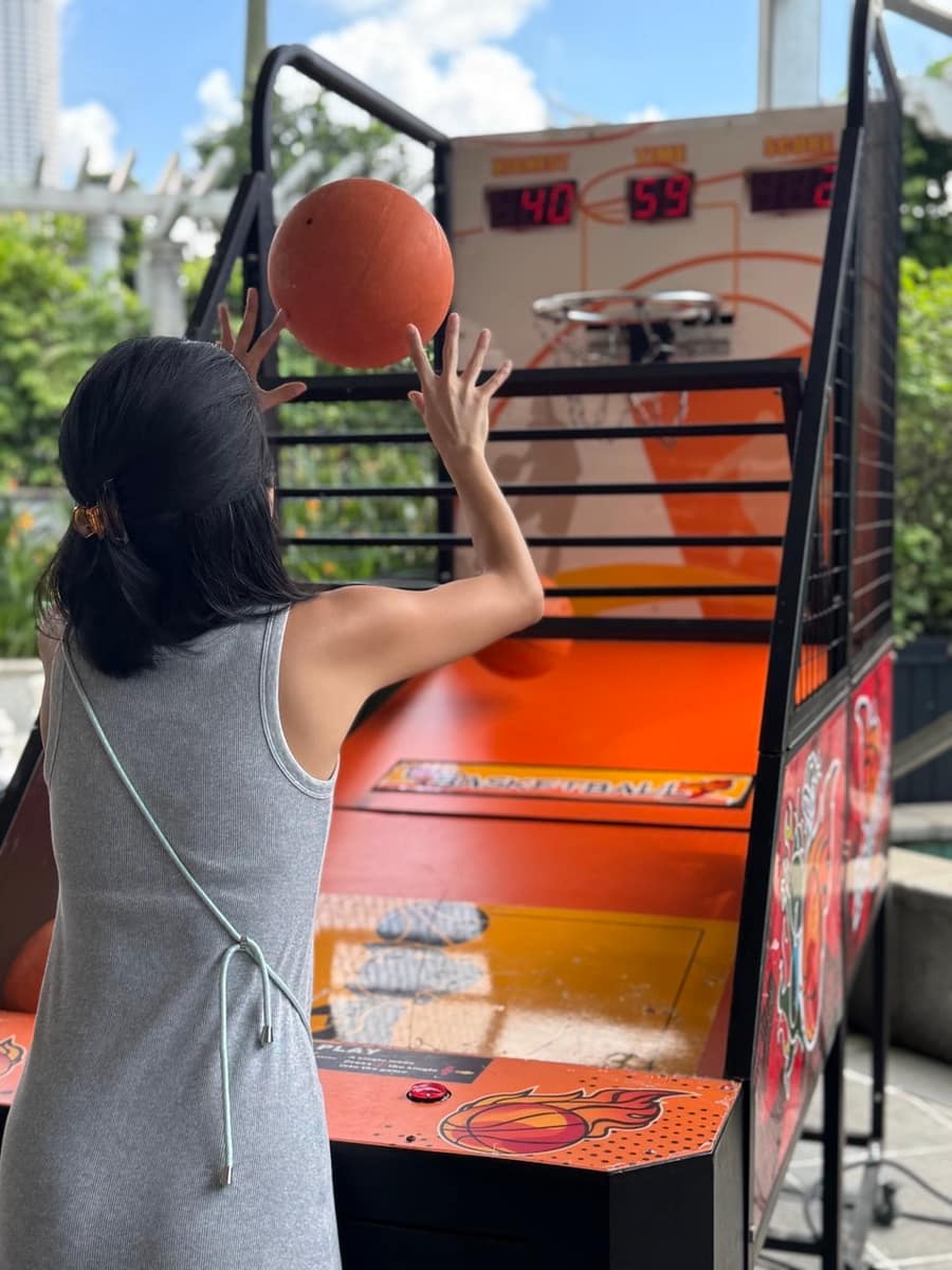 Guest playing arcade basketball
