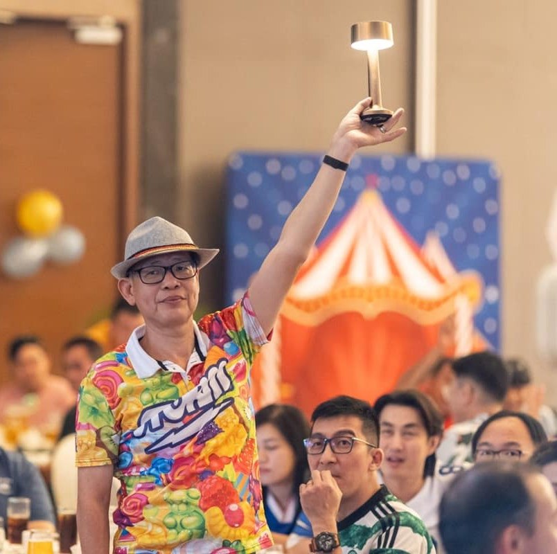 Emcee hosting a programme segment at an event