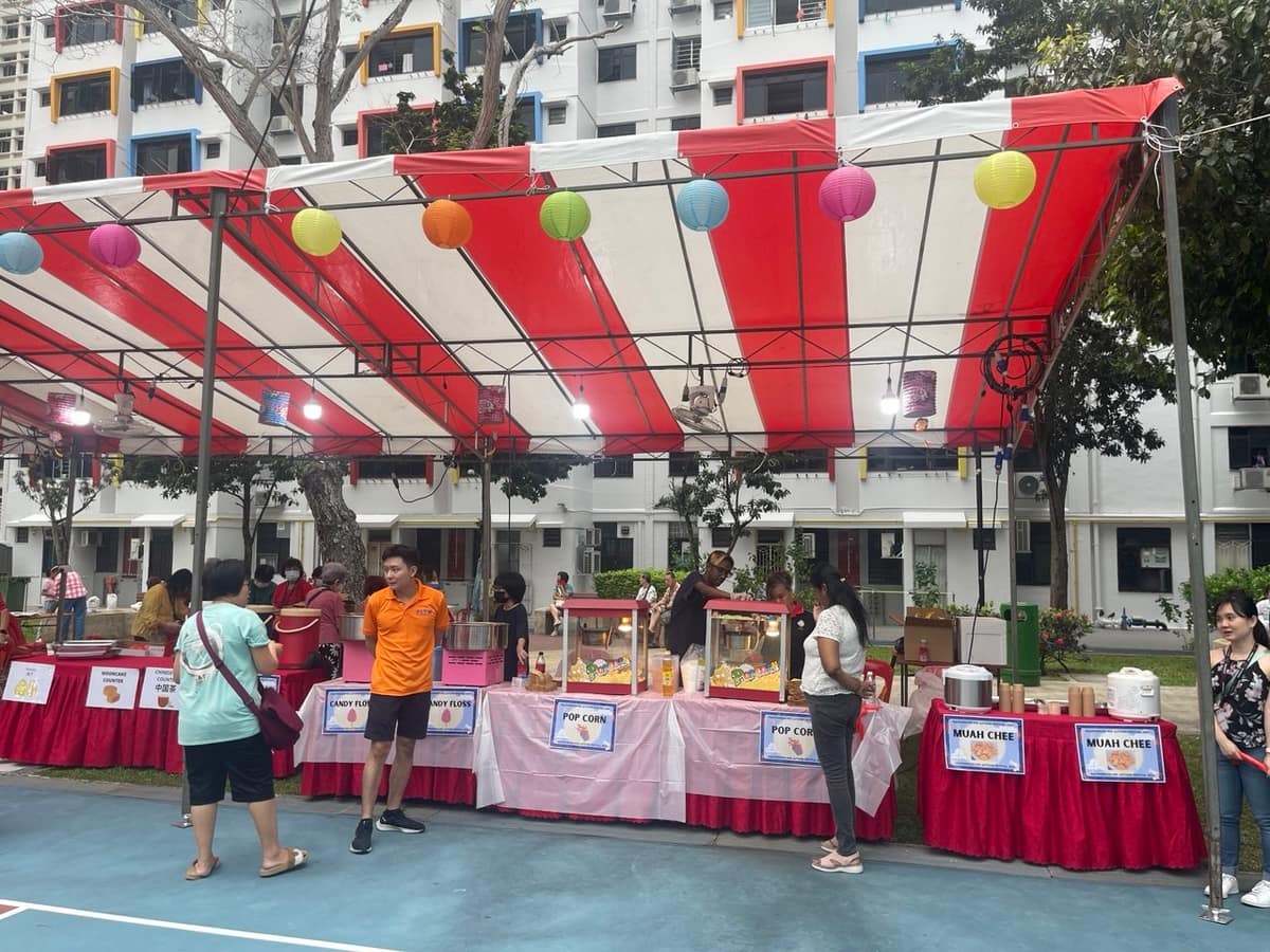 Multi-stall carnival tent at an outdoor event by BounceParkSG