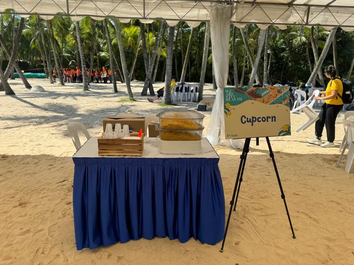 Food table set up at a beach corporate event