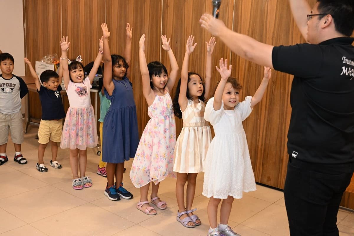 Magician performing for children at a birthday party