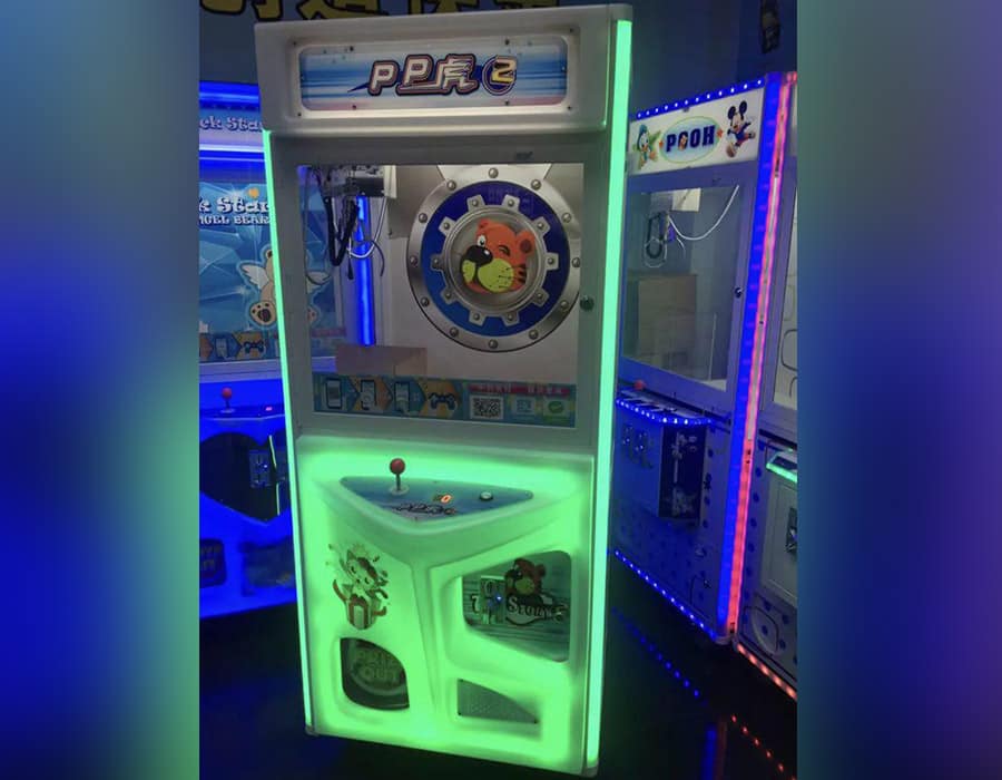 Claw machines set up at an indoor event